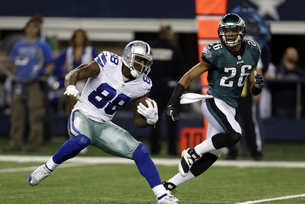 Dallas Cowboys wide receiver Dez Bryant (88) finds running room after grabbing  a pass as Philadelphia Eagles cornerback Cary Williams (26) gives chase during the second half of an NFL football game, Sunday, Dec. 29, 2013, in Arlington, Texas. (AP Photo/Tim Sharp)