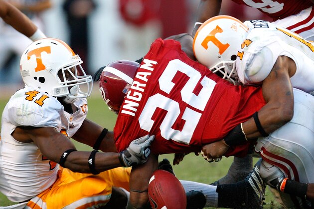 TUSCALOOSA, AL - OCTOBER 24:  Dennis Rogan #41 and Eric Berry #14 of the Tennessee Volunteers force a fumble by Mark Ingram #22 of the Alabama Crimson Tide at Bryant-Denny Stadium on October 24, 2009 in Tuscaloosa, Alabama.  (Photo by Kevin C. Cox/Getty Images)