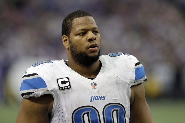 Detroit Lions defensive tackle Ndamukong Suh walks on the field during the first half of an NFL football game against the Minnesota Vikings, Sunday, Dec. 29, 2013, in Minneapolis. (AP Photo/Jim Mone)