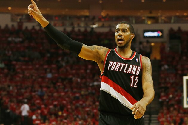 HOUSTON, TX - APRIL 23:  LaMarcus Aldridge #12 of the Portland Trail Blazers celebrates a play on the court in the second half of the game against the Houston Rockets in Game Two of the Western Conference Quarterfinals during the 2014 NBA Playoffs at Toyota Center on April 23, 2014 in Houston, Texas. NOTE TO USER: User expressly acknowledges and agrees that, by downloading and or using this photograph, User is consenting to the terms and conditions of the Getty Images License Agreement.  (Photo by Scott Halleran/Getty Images)