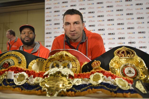 Boxing champion Wladimir Klitschko of Ukraine sits behind his belts as he attends a press conference ahead of his IBF, IBO, WBO and WBA heavyweight title bout against challenger Alex Leapai from Australia-Samoa in Duesseldorf, Germany, Tuesday, April 22, 2014. (AP Photo/Martin Meissner) Boxing champion Wladimir Klitschko of Ukraine sits behind his belts as he attends a press conference ahead of his IBF, IBO, WBO and WBA heavyweight title bout against challenger Alex Leapai from Australia-Samoa in Duesseldorf, Germany, Tuesday, April 22, 2014. (AP Photo/Martin Meissner)