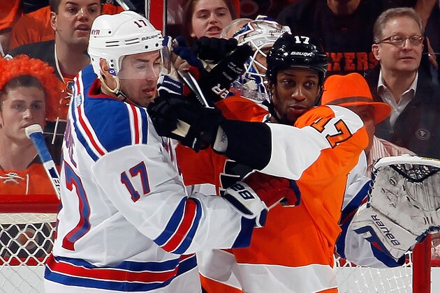PHILADELPHIA, PA - APRIL 22: John Moore #17 of the New York Rangers goes against Wayne Simmonds #17 of the Philadelphia Flyers in Game Three of the First Round of the 2014 NHL Stanley Cup Playoffs at the Wells Fargo Center on April 22, 2014 in Philadelphia, Pennsylvania. The Rangers defeated the Flyers 4-1.  (Photo by Bruce Bennett/Getty Images)