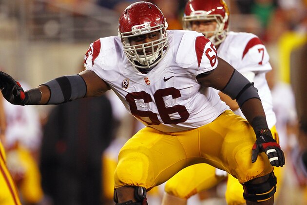 EAST RUTHERFORD, NJ - SEPTEMBER 08:  Marcus Martin #66 of the USC Trojans looks to block against the Syracuse Orange during a game at MetLife Stadium on September 8, 2012 in East Rutherford, New Jersey. (Photo by Rich Schultz/Getty Images)