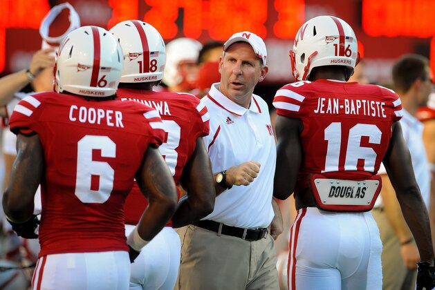 LINCOLN, NE - AUGUST 31: Nebraska Cornhuskers head coach Bo Pelini greets players before their game against the Wyoming Cowboys at Memorial Stadium on August 31, 2013 in Lincoln, Nebraska.  (Photo by Eric Francis/Getty Images)