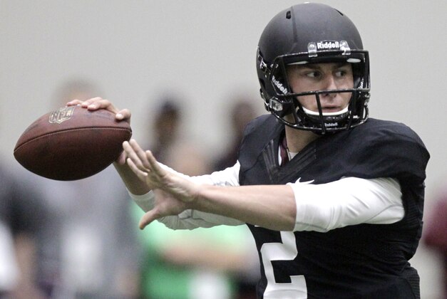 Texas A&M quarterback Johnny Manziel passes the ball during a drill at pro day for NFL football representatives in College Station, Texas, Thursday, March 27, 2014. (AP Photo/Patric Schneider)
