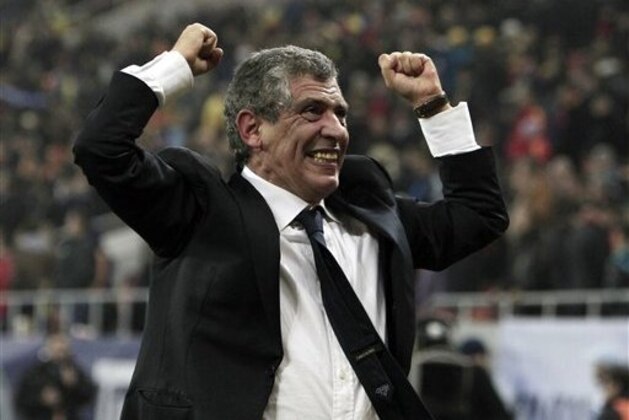 FILE - In this Nov. 19, 2013, file photo, Fernando Santos, the coach of Greece, celebrates after defeating Romania in their World Cup qualifying playoff second leg match at the National Arena in Bucharest. Greece coach Fernando Santos will step down after the World Cup, but says he's glad to help lift the country's spirits after it endured four years of severe financial crisis. (AP Photo/Thanassis Stavrakis, File)