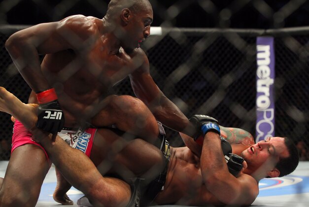 Apr 27, 2013; Newark, NJ, USA; Phil Davis (red shorts) competes against Vinny Magalhaes (black shorts) during UFC 159 at the Prudential Center. Mandatory Credit: Brad Penner-USA TODAY Sports Apr 27, 2013; Newark, NJ, USA; Phil Davis (red shorts) competes against Vinny Magalhaes (black shorts) during UFC 159 at the Prudential Center. Mandatory Credit: Brad Penner-USA TODAY Sports