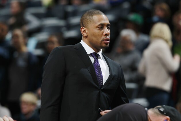 Toronto Raptors team ambassador Jamaal Magloire looks on from the bench before the Raptors face the Denver Nuggets in the first quarter of an NBA basketball game in Denver on Friday, Jan. 31, 2014. (AP Photo/David Zalubowski)