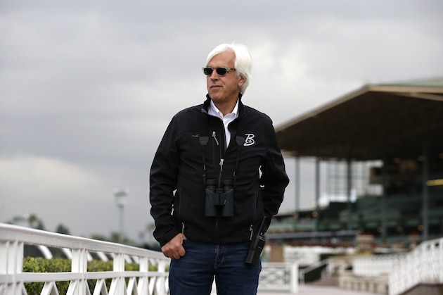 In this photo taken Monday, Oct. 28, 2013, trainer Bob Baffert watches horses work out in preparation for this weekend's Breeders' Cup horse races at Santa Anita Park in Arcadia, Calif. (AP Photo/Jae C. Hong)