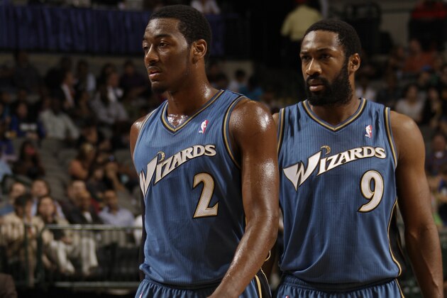 DALLAS - OCTOBER 05: John Wall #2 and Gilbert Arenas #9 of the Washington Wizards take to the court against the Dallas Mavericks during a preseason game on October 5, 2010 at the American Airlines Center in Dallas, Texas. NOTE TO USER: User expressly acknowledges and agrees that, by downloading and or using this photograph, User is consenting to the terms and conditions of the Getty Images License Agreement. Mandatory Copyright Notice: Copyright 2010 NBAE (Photo by Danny Bollinger/NBAE via Getty Images) DALLAS - OCTOBER 05: John Wall #2 and Gilbert Arenas #9 of the Washington Wizards take to the court against the Dallas Mavericks during a preseason game on October 5, 2010 at the American Airlines Center in Dallas, Texas. NOTE TO USER: User expressly acknowledges and agrees that, by downloading and or using this photograph, User is consenting to the terms and conditions of the Getty Images License Agreement. Mandatory Copyright Notice: Copyright 2010 NBAE (Photo by Danny Bollinger/NBAE via Getty Images)