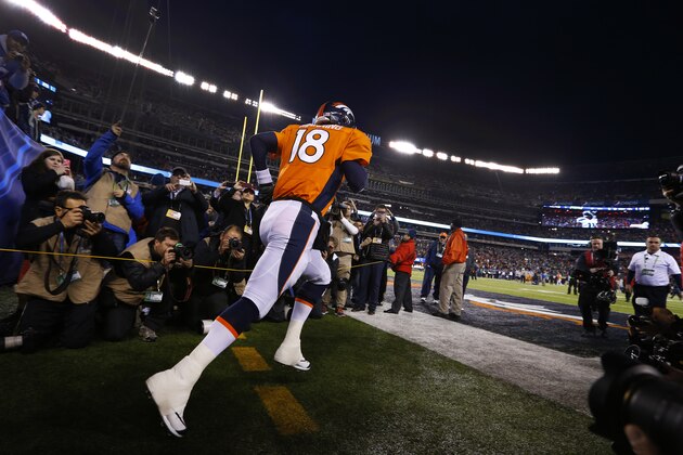 Denver Broncos quarterback Peyton Manning runs onto the field before the NFL Super Bowl XLVIII football game against the Seattle Seahawks at MetLife Stadium Sunday, Feb. 2, 2014, in East Rutherford, N.J. The Seahawks won 43-8. (AP Photo/Paul Sancya)