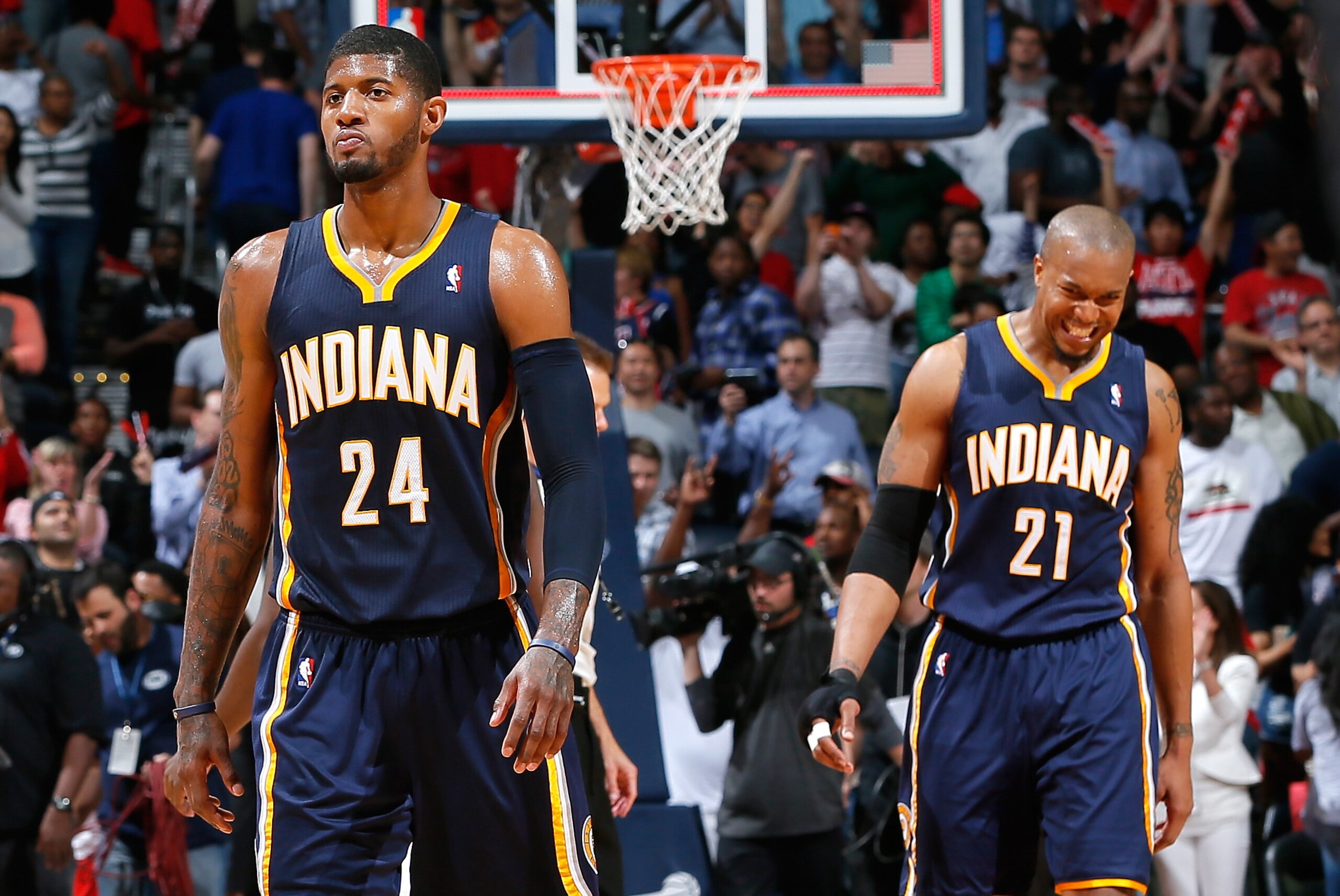 ATLANTA, GA - APRIL 24:   Paul George #24 and David West #21 of the Indiana Pacers react after their 98-85 loss to the Atlanta Hawks in Game 3 of the Eastern Conference Quarterfinals during the 2014 NBA Playoffs at Philips Arena on April 24, 2014 in Atlanta, Georgia.  NOTE TO USER: User expressly acknowledges and agrees that, by downloading and or using this photograph, User is consenting to the terms and conditions of the Getty Images License Agreement.  (Photo by Kevin C. Cox/Getty Images)