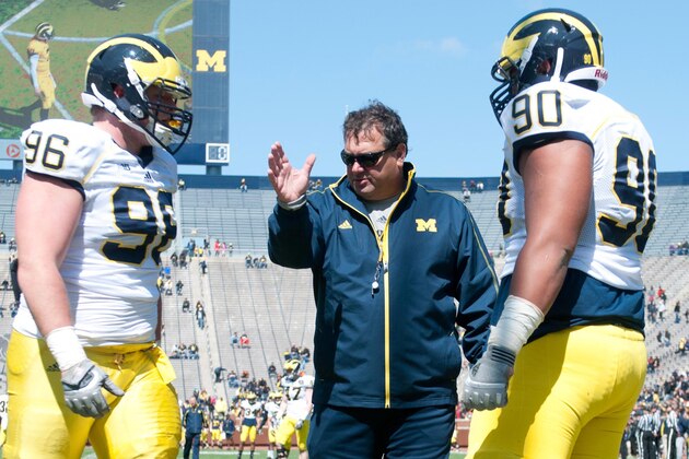 Apr 5, 2014; Ann Arbor, MI, USA; Michigan Wolverines head coach Brady Hoke coaches defensive lineman Ryan Glasgow (96) and defensive tackle Bryan Mone (90) during the Spring Game at Michigan Stadium. Mandatory Credit: Tim Fuller-USA TODAY Sports Apr 5, 2014; Ann Arbor, MI, USA; Michigan Wolverines head coach Brady Hoke coaches defensive lineman Ryan Glasgow (96) and defensive tackle Bryan Mone (90) during the Spring Game at Michigan Stadium. Mandatory Credit: Tim Fuller-USA TODAY Sports