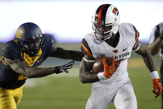 Oregon State wide receiver Brandin Cooks (7) runs past California defensive back Kameron Jackson (3) during the second half of an NCAA college football game in Berkeley, Calif., Saturday, Oct. 19, 2013. (AP Photo/Tony Avelar)