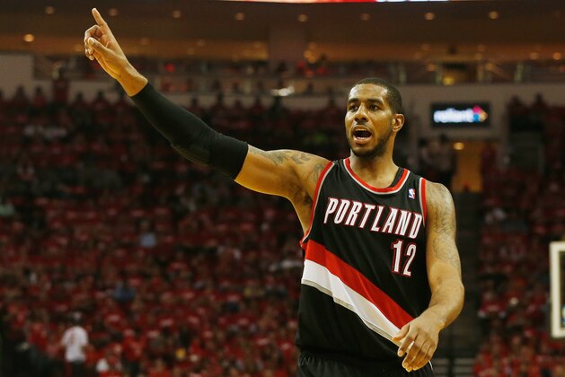 HOUSTON, TX - APRIL 23:  LaMarcus Aldridge #12 of the Portland Trail Blazers celebrates a play on the court in the second half of the game against the Houston Rockets in Game Two of the Western Conference Quarterfinals during the 2014 NBA Playoffs at Toyota Center on April 23, 2014 in Houston, Texas. NOTE TO USER: User expressly acknowledges and agrees that, by downloading and or using this photograph, User is consenting to the terms and conditions of the Getty Images License Agreement.  (Photo by Scott Halleran/Getty Images)