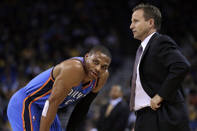 Oklahoma City Thunder coach Scott Brooks, right, speaks with Russell Westbrook during the first half of an NBA basketball game against the Golden State Warriors, Thursday, Nov. 14, 2013, in Oakland, Calif. (AP Photo/Ben Margot)