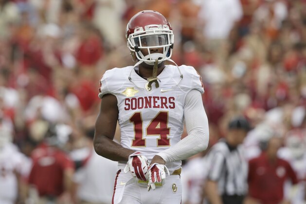 Oklahoma defensive back Aaron Colvin (14) walks on the field during the first half of an NCAA college football game at the Cotton Bowl  Saturday, Oct. 12, 2013, in Dallas. (AP Photo/LM Otero)