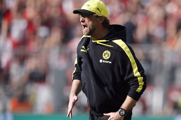 Dortmund head coach Juergen Klopp shouts during the German first division Bundesliga soccer match between BvB Borussia Dortmund and Mainz 05 in Dortmund, Germany, Saturday, April 19, 2014. (AP Photo/Frank Augstein)