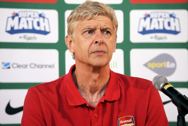Arsenal manager Arsene Wenger, during a press conference, at the Helsinki airport in Vantaa, Finland, Friday, Aug. 9, 2013. Premier League giants Manchester City and Arsenal play their pre-season's last training match at the Helsinki Olympic Stadium on Saturday. (AP Photo/Lehtikuva, Mikko Stig)   FINLAND OUT