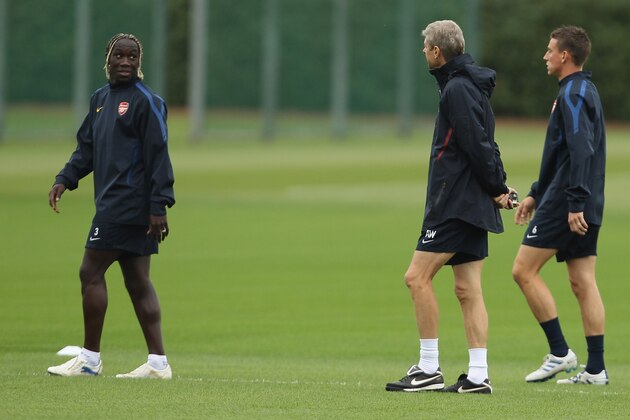 LONDON, ENGLAND - SEPTEMBER 14:  Arsenal's Manager Arsene Wenger speaks to Bacary Sagna during a training session ahead of the UEFA Champions League game against Braga at the club's complex in London Colney on September 14, 2010 in London, England.  (Photo by Ian Walton/Getty Images)