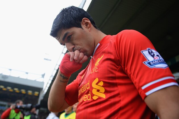 NORWICH, ENGLAND - APRIL 20:  Luis Suarez of Liverpool kisses his hand as he walks out during the Barclays Premier League match between Norwich City and Liverpool at Carrow Road on April 20, 2014 in Norwich, England.  (Photo by Michael Regan/Getty Images)