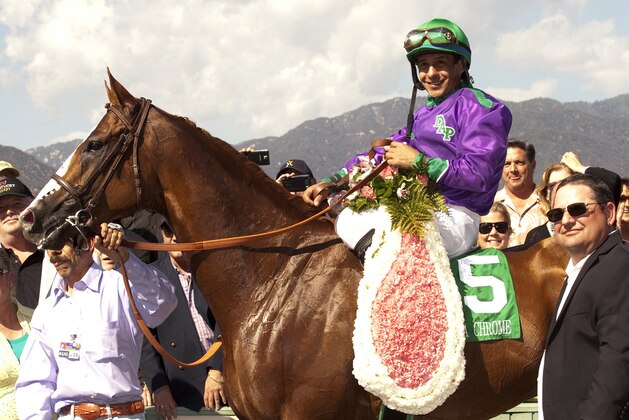 In a photo provided by Benoit Photo, California Chrome and jockey Victor Espinoza pose in the winner's circle after victory in the Santa Anita Derby horse race Saturday, April 5, 2014, at Santa Anita in Arcadia, Calif. (AP Photo/Benoit Photo) In a photo provided by Benoit Photo, California Chrome and jockey Victor Espinoza pose in the winner's circle after victory in the Santa Anita Derby horse race Saturday, April 5, 2014, at Santa Anita in Arcadia, Calif. (AP Photo/Benoit Photo)