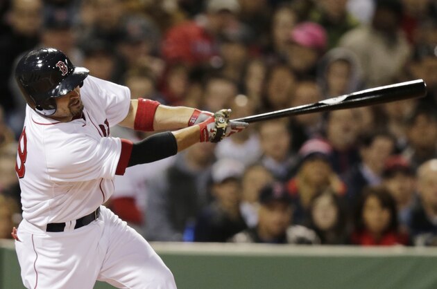 Boston Red Sox right fielder Shane Victorino singles during the third inning of a baseball game against the New York Yankees, Thursday, April 24, 2014, in Boston. (AP Photo/Charles Krupa)