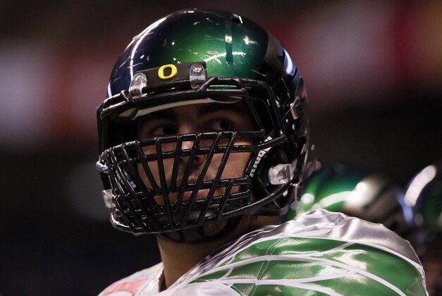 Dec 30, 2013; San Antonio, TX, USA; Oregon Ducks offensive lineman Hroniss Grasu (55) warms up before the game against the Texas Longhorns during the first half at Alamo Dome. Mandatory Credit: Soobum Im-USA TODAY Sports