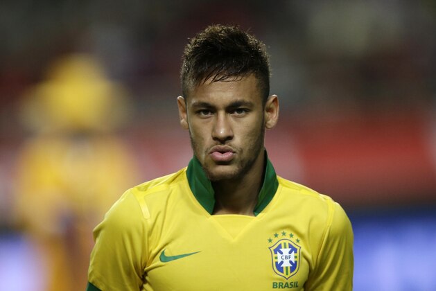Brazil's Neymar lines up before their friendly soccer match against South Korea at Seoul World Cup Stadium in Seoul, South Korea, Saturday, Oct.12, 2013. (AP Photo/Lee Jin-man)
