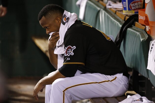 Pittsburgh Pirates starting pitcher Francisco Liriano (47) sits in the dugout in the eighth inning after being removed from a baseball game against the Cincinnati Reds in Pittsburgh Monday, April 21, 2014. The Pirates won 6-5. (AP Photo/Gene J. Puskar)