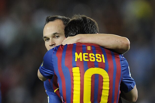 BARCELONA, SPAIN - OCTOBER 15:  Lionel Messi of FC Barcelona celebrates with his teammate Andres Iniesta (L) after scoring his third team's goal during the La Liga match between FC Barcelona and Real Racing Club at Camp Nou on October 15, 2011 in Barcelona, Spain.  (Photo by David Ramos/Getty Images)