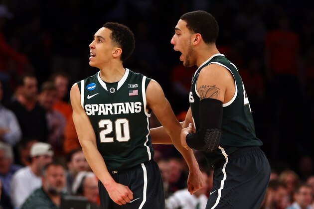NEW YORK, NY - MARCH 28:  Travis Trice #20 and Denzel Valentine #45 of the Michigan State Spartans celebrate after a basket in the second half against the Virginia Cavaliers during the regional semifinal of the 2014 NCAA Men's Basketball Tournament at Madison Square Garden on March 28, 2014 in New York City.  (Photo by Elsa/Getty Images)