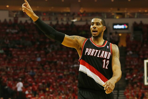 HOUSTON, TX - APRIL 23:  LaMarcus Aldridge #12 of the Portland Trail Blazers celebrates a play on the court in the second half of the game against the Houston Rockets in Game Two of the Western Conference Quarterfinals during the 2014 NBA Playoffs at Toyota Center on April 23, 2014 in Houston, Texas. NOTE TO USER: User expressly acknowledges and agrees that, by downloading and or using this photograph, User is consenting to the terms and conditions of the Getty Images License Agreement.  (Photo by Scott Halleran/Getty Images)