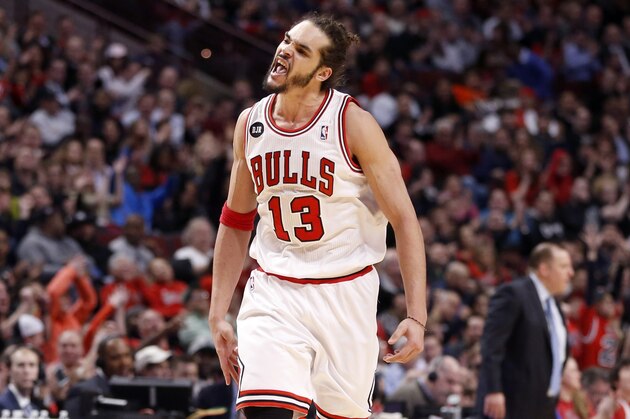 Chicago Bulls center Joakim Noah (13) celebrates the Bulls' expanding lead on the Indiana Pacers during the second half of an NBA basketball game Monday, March 24, 2014, in Chicago. The Bulls won 89-77. (AP Photo/Charles Rex Arbogast)