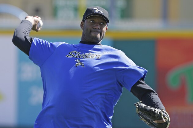 Retired NBA All-Star Tracy McGrady throws a pitch at the Sugar Land Skeeters baseball stadium Wednesday, Feb. 12, 2014, in Sugar Land, Texas. McGrady hopes to try out as a pitcher for the independent Atlantic League Skeeters. (AP Photo/Pat Sullivan)