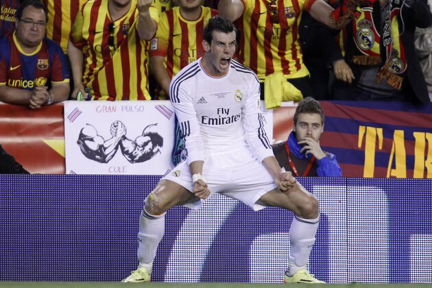 Real's Gareth Bale celebrates scoring his team's 2nd goal during the final of the Copa del Rey between FC Barcelona and Real Madrid at the Mestalla stadium in Valencia, Spain, Wednesday, April 16, 2014. (AP Photo/Alberto Saiz) Real's Gareth Bale celebrates scoring his team's 2nd goal during the final of the Copa del Rey between FC Barcelona and Real Madrid at the Mestalla stadium in Valencia, Spain, Wednesday, April 16, 2014. (AP Photo/Alberto Saiz)