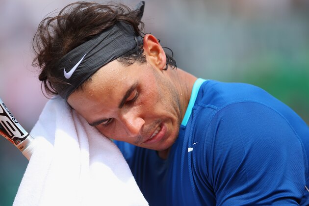 MONTE-CARLO, MONACO - APRIL 18:  Rafael Nadal of Spain wipes his face in his match against David Ferrer of Spain during day six of the ATP Monte Carlo Rolex Masters Tennis at Monte-Carlo Sporting Club on April 18, 2014 in Monte-Carlo, Monaco.  (Photo by Julian Finney/Getty Images)