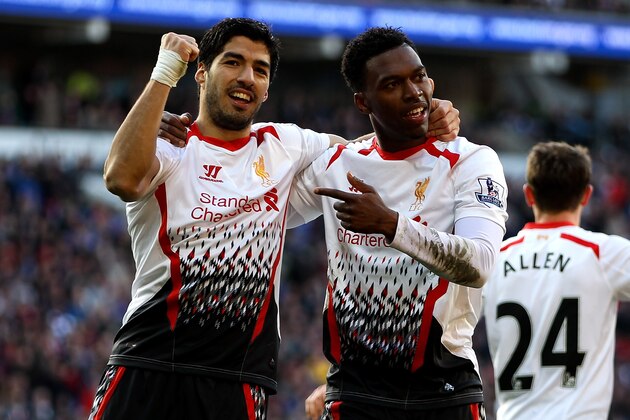 CARDIFF, WALES - MARCH 22:  Daniel Sturridge of Liverpool celebrates with team mate Luis Suarez after scoring his team's fifth goal during the Barclays Premier League match between Cardiff City and Liverpool at Cardiff City Stadium on March 22, 2014 in Cardiff, Wales.  (Photo by Ben Hoskins/Getty Images)