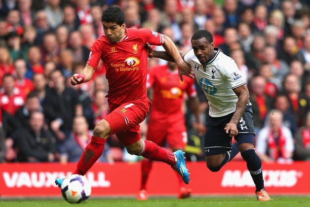 LIVERPOOL, ENGLAND - MARCH 30:  Luis Suarez of Liverpool competes with Danny Rose of Tottenham Hotspur during the Barclays Premier League match between Liverpool and Tottenham Hotspur at Anfield on March 30, 2014 in Liverpool, England.  (Photo by Alex Livesey/Getty Images)