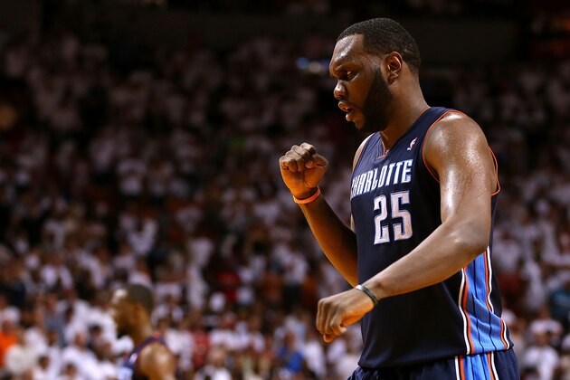 Charlotte Bobcats' Al Jefferson (25) looks to pass as Miami Heat's Chris Andersen (11) defends during the first half in Game 1 of an opening-round NBA basketball playoff series on Sunday, April 20, 2014, in Miami. (AP Photo/Lynne Sladky)