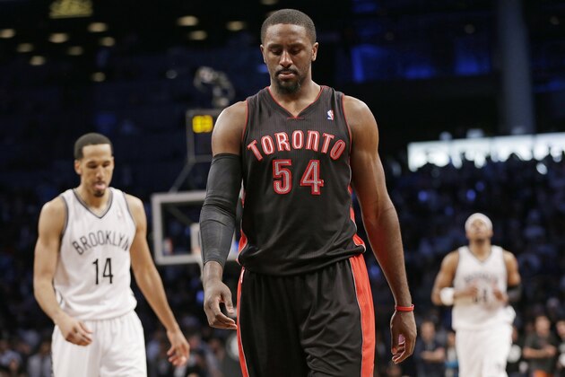 Toronto Raptors' Patrick Patterson (54) looks down during the second half of Game 3 of an NBA basketball first-round playoff series against the Brooklyn Nets on Friday, April 25, 2014, in New York. The Nets won 102-98. (AP Photo/Frank Franklin II)
