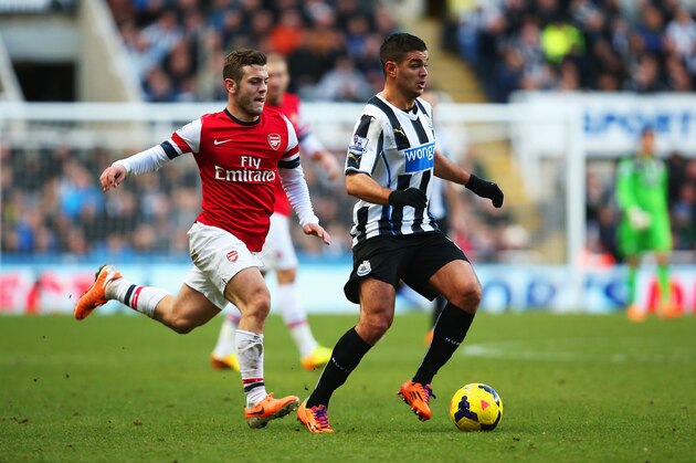 NEWCASTLE UPON TYNE, ENGLAND - DECEMBER 29: Hatem Ben Arfa of Newcastle United is closed down by Jack Wilshere of Arsenal during the Barclays Premier League match between Newcastle United and Arsenal at St James' Park on December 29, 2013 in Newcastle upon Tyne, England.  (Photo by Jan Kruger/Getty Images)