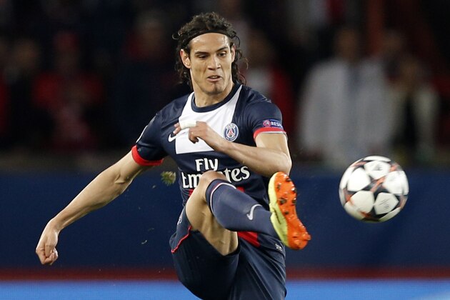 PSG's Edinson Cavani kicks during the Champions League quarterfinal first leg soccer match between PSG and Chelsea, at the Parc des Princes stadium, in Paris, Wednesday, April 2, 2014. (AP Photo/Christophe Ena)