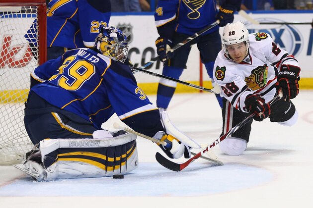 ST. LOUIS, MO - APRIL 25: Ryan Miller #39 of the St. Louis Blues makes a save against Ben Smith #28 of the Chicago Blackhawks in Game Five of the First Round of the 2014 Stanley Cup Playoffs at the Scottrade Center on April 25, 2014 in St. Louis, Missouri. (Photo by Dilip Vishwanat/Getty Images) ST. LOUIS, MO - APRIL 25: Ryan Miller #39 of the St. Louis Blues makes a save against Ben Smith #28 of the Chicago Blackhawks in Game Five of the First Round of the 2014 Stanley Cup Playoffs at the Scottrade Center on April 25, 2014 in St. Louis, Missouri. (Photo by Dilip Vishwanat/Getty Images)