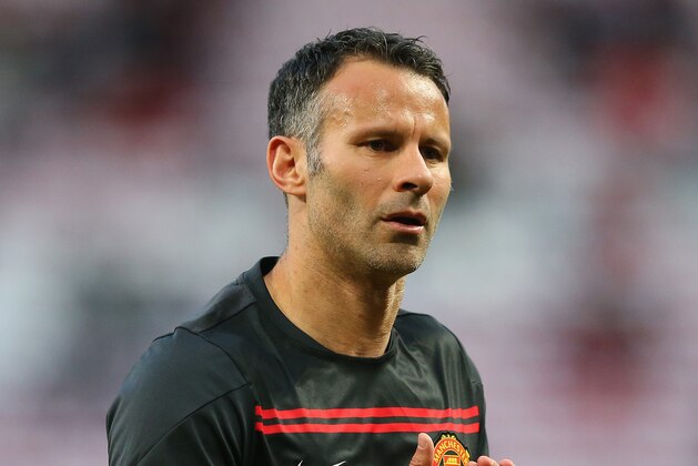 MANCHESTER, ENGLAND - APRIL 01:  Ryan Giggs of Manchester United warms up during the UEFA Champions League Quarter Final first leg match between Manchester United and FC Bayern Muenchen at Old Trafford on April 1, 2014 in Manchester, England.  (Photo by Alex Livesey/Getty Images)