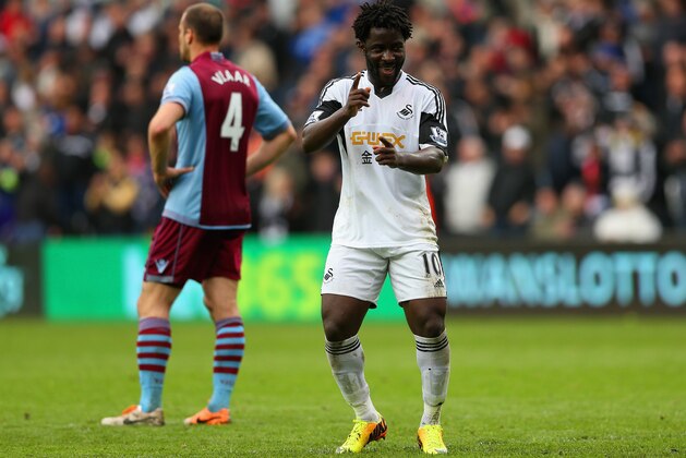 SWANSEA, WALES - APRIL 26:  Wilfried Bony of Swansea City celebrates scoring their fourth goal during the Barclays Premier League match between Swansea City and Aston Villa at Liberty Stadium on April 26, 2014 in Swansea, Wales.  (Photo by Scott Heavey/Getty Images)