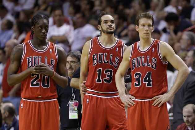 Chicago Bulls' Tony Snell (20), Joakim Noah (13) and Mike Dunleavy (34) stand on the court during a time out in the second half of an NBA basketball gam against the Miami Heate, Sunday, Feb. 23, 2014, in Miami. The Heat defeated the Bulls 93-79. (AP Photo/Lynne Sladky) Chicago Bulls' Tony Snell (20), Joakim Noah (13) and Mike Dunleavy (34) stand on the court during a time out in the second half of an NBA basketball gam against the Miami Heate, Sunday, Feb. 23, 2014, in Miami. The Heat defeated the Bulls 93-79. (AP Photo/Lynne Sladky)