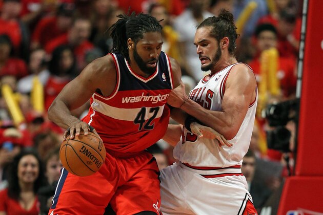 CHICAGO, IL - APRIL 20: Nene #42 of the Washington Wizards moves against Joakim Noah #13 of the Chicago Bulls in Game One of the Eastern Conference Quarterfinals during the 2014 NBA Playoffs at the United Center on April 20, 2014 in Chicago, Illinois. The Wizards defeated the Bulls 102-93. NOTE TO USER: User expressly acknowledges and agrees that, by downloading and or using this photograph, User is consenting to the terms and conditions of the Getty Images License Agreement.  (Photo by Jonathan Daniel/Getty Images)