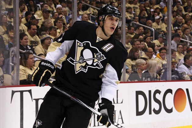 Pittsburgh Penguins' Evgeni Malkin (71) prepares for a face off in the second period of a first-round NHL playoff hockey game against the Columbus Blue Jackets in Pittsburgh Wednesday, April 16, 2014. The Penguins won 4-3. (AP Photo/Gene J. Puskar)