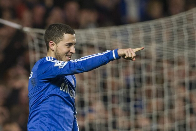 Chelsea's Eden Hazard celebrates after scoring against Tottenham Hotspur during their English Premier League soccer match, at the Stamford Bridge Stadium in London, Saturday March 8, 2014. (AP Photo/Bogdan Maran) Chelsea's Eden Hazard celebrates after scoring against Tottenham Hotspur during their English Premier League soccer match, at the Stamford Bridge Stadium in London, Saturday March 8, 2014. (AP Photo/Bogdan Maran)